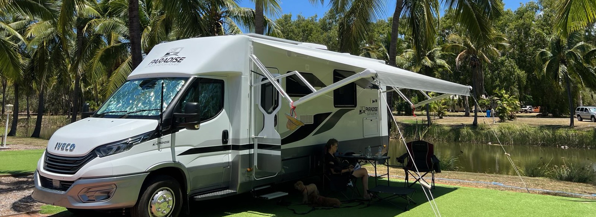 paradise spark motorhome with awning out among palm trees Paradise Spark motorhome with awning out among palm trees